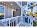 Inviting condo balcony with outdoor seating, perfect for enjoying the ocean breeze and scenic views at 6000 Boca Grande Cswy # D38, Boca Grande, FL 33921