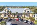 Apartment complex with well-maintained landscaping and ample parking at 6610 Gasparilla Pines Blvd # 113, Englewood, FL 34224