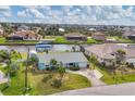 Charming waterfront home with well-manicured lawn, lush landscaping, and private boat dock on a canal at 9382 Rosebud Cir, Port Charlotte, FL 33981