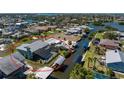 Waterfront home with screened pool, boat lift, and dock on canal with access to Gulf of Mexico at 1052 Newton St, Englewood, FL 34224