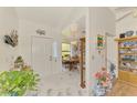 Bright foyer with white marble floors, leading to the dining area, creating a welcoming entrance at 1173 Brown St, Englewood, FL 34224