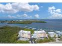 Beautiful aerial of the condo complex, surrounded by water, with easy access to the marina at 1420 Beach Rd # 203, Englewood, FL 34223
