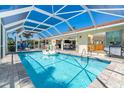 Screened-in pool and lanai, perfect for outdoor relaxation and entertainment, with easy access to the interior at 471 Capri Isles Ct, Punta Gorda, FL 33950