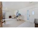 Bright living room featuring tile entryway, white walls, and comfortable seating at 51 Mark Twain Ln, Rotonda West, FL 33947
