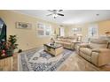 Spacious living room with neutral decor, tile flooring, and plenty of natural light at 10183 Winding River Rd, Punta Gorda, FL 33950