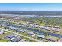 Residential neighborhood with waterfront homes and canal access at 13 Caddy Rd, Rotonda West, FL 33947