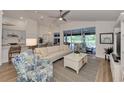 Spacious open-concept living area with kitchen and lanai views, perfect for entertaining at 14236 Silver Lakes Cir, Port Charlotte, FL 33953