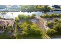 Waterfront property offers serene water views and lush greenery for ultimate relaxation at 14246 Maysville, Port Charlotte, FL 33981