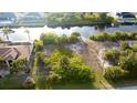 Waterfront property offers serene water views and lush greenery for ultimate relaxation at 14246 Maysville, Port Charlotte, FL 33981