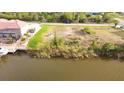 Waterfront lot on canal with seawall, perfect for boaters and water enthusiasts at 15342 Aron, Port Charlotte, FL 33981