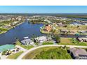A waterfront community with beautiful single-Gathering homes, canals, and manicured landscaping at 15498 Seafoam Cir, Port Charlotte, FL 33981