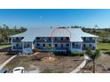 The building's facade features balconies and covered parking at 6800 Placida Rd # 272, Englewood, FL 34224