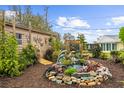 Backyard featuring a custom water feature and meticulous landscaping at 7339 Thomas St, Englewood, FL 34224