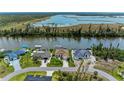 A canal-front property with lush lawns, a boat dock, and a charming single-Gathering home at 10640 Ayear Rd, Port Charlotte, FL 33981