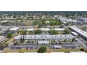 An aerial shot showcasing the entire property, including buildings, pool, and parking areas at 2437 Harbor Blvd # 204, Port Charlotte, FL 33952