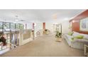 Common space with an elevator and seating area for residents at 2437 Harbor Blvd # 204, Port Charlotte, FL 33952