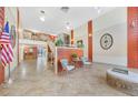 Inviting lobby area with seating, decor, and views of the upper level, creating a welcoming atmosphere at 2437 Harbor Blvd # 204, Port Charlotte, FL 33952