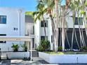 Charming condo exterior with covered parking and lush landscaping at 2955 N Beach Rd # D123, Englewood, FL 34223