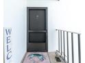Stylish front entrance with welcome sign and a peek at the charming decor at 2955 N Beach Rd # D123, Englewood, FL 34223