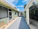 Exterior walkway with covered space between the home and the carport at 2985 N Beach Rd # Bv-5, Englewood, FL 34223