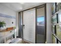 Bright foyer with white door, side glass panels, and tile floors for a clean entry at 311 Garvin St # 209C, Punta Gorda, FL 33950