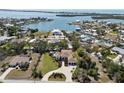Expansive aerial view showcasing the waterfront community, with a focus on the well-manicured home and its prime location at 425 Spaniards Rd, Placida, FL 33946