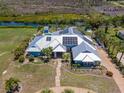 Expansive estate featuring solar panels, lush landscaping and waterfront access at 50 Spyglass Aly, Placida, FL 33946
