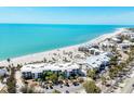 An aerial view of condos along a white sand beach with turquoise waters at 5000 Gasparilla Rd # 41B, Boca Grande, FL 33921