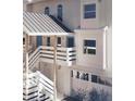 Detailed view of a townhome's entryway and private garage, featuring a unique coastal design at 5800 Gulf Shores Dr # 33, Boca Grande, FL 33921