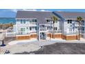 Coastal condos with outdoor living spaces, showing a well-kept exterior with water views in the background at 6040 Boca Grande Cswy # A2, Boca Grande, FL 33921