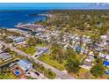 Stunning aerial view of a coastal community with waterfront homes and a scenic marina at 698 & West W Perry St, Englewood, FL 34223