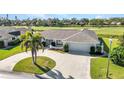 Attractive home with a well-kept yard and circular driveway at 977 N Doral Ln, Venice, FL 34293