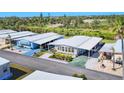 An aerial view of a cozy home featuring a large, screened-in lanai at 985 Jolanda Cir, Venice, FL 34285