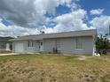 Lovely single-story home with a tidy front lawn, attached garage, and an inviting entrance at 11090 Mcfadden Ave, Englewood, FL 34224