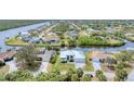 Scenic aerial view of a waterfront property, showcasing the home's location on the canal at 18610 Ayrshire, Port Charlotte, FL 33981