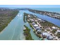 Breathtaking aerial view of waterfront homes along winding waterways, perfect for boating enthusiasts at 310 Kettle Harbor Dr, Placida, FL 33946