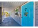 Welcome home to this cheerful condo; the front door is painted in a bright turquoise color at 4410 Warren Ave # 217, Port Charlotte, FL 33953