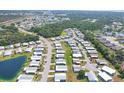 Wide aerial view of a Florida retirement community filled with cozy mobile homes and green spaces at 816 Tangerine Woods Blvd, Englewood, FL 34223