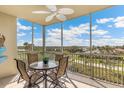 This screened balcony has a ceiling fan and beautiful views at 10055 Links Ln # 402, Rotonda West, FL 33947