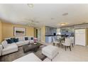 Open-concept living room and kitchen with tile flooring and a bright, inviting atmosphere at 1160 Sharlo Cir, Englewood, FL 34224