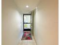 Entryway hall featuring a tile floor and entrance door at 149 Englewood Isles Pkwy # 609, Englewood, FL 34223