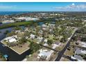 Expansive aerial view of waterfront community, showcasing canals, docks, and proximity to the ocean at 1493 Kathleen Pl, Englewood, FL 34223