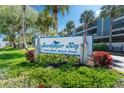 A lushly landscaped sign for Sandpiper Key at 1401-1551 Beach Road at 1551 Beach Rd # 207, Englewood, FL 34223
