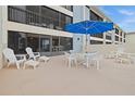 The condo's large patio is perfect for entertaining with plenty of seating at 1551 Beach Rd # 207, Englewood, FL 34223