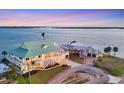 Waterfront home with an expansive lot, complemented by picturesque views of the surrounding neighborhood and serene bay at 1905 Mississippi Ave, Englewood, FL 34224