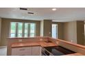 Bright kitchen featuring modern appliances and a bay window at 3415 Gulf Ln, Rotonda West, FL 33947