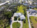 Expansive property with a circular driveway, lush lawn, private pool, and an oversized driveway for boat parking at 60 N Oxford Dr, Englewood, FL 34223