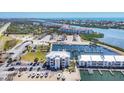 Overhead view of waterfront condos with boat docks and boat parking, offering a coastal living experience at 7070 Placida Rd # 1230, Placida, FL 33946