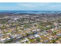 Expansive aerial view of a residential area with waterfront homes and a beautiful ocean backdrop at 832 E 4Th St, Englewood, FL 34223