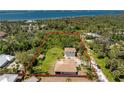 Aerial view of the property showcasing the surrounding greenery and proximity to the waterfront at 941 Allen Ave, Englewood, FL 34223